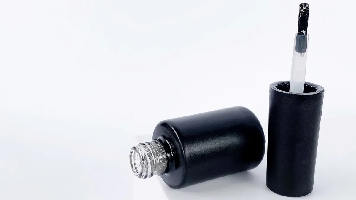A single nail polish bottle on a clean white surface