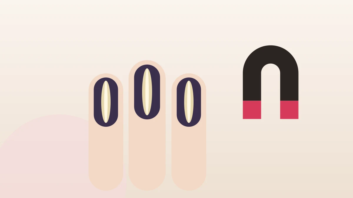 Three nails in dark polish with a bright cat eye stripe, beside a magnet